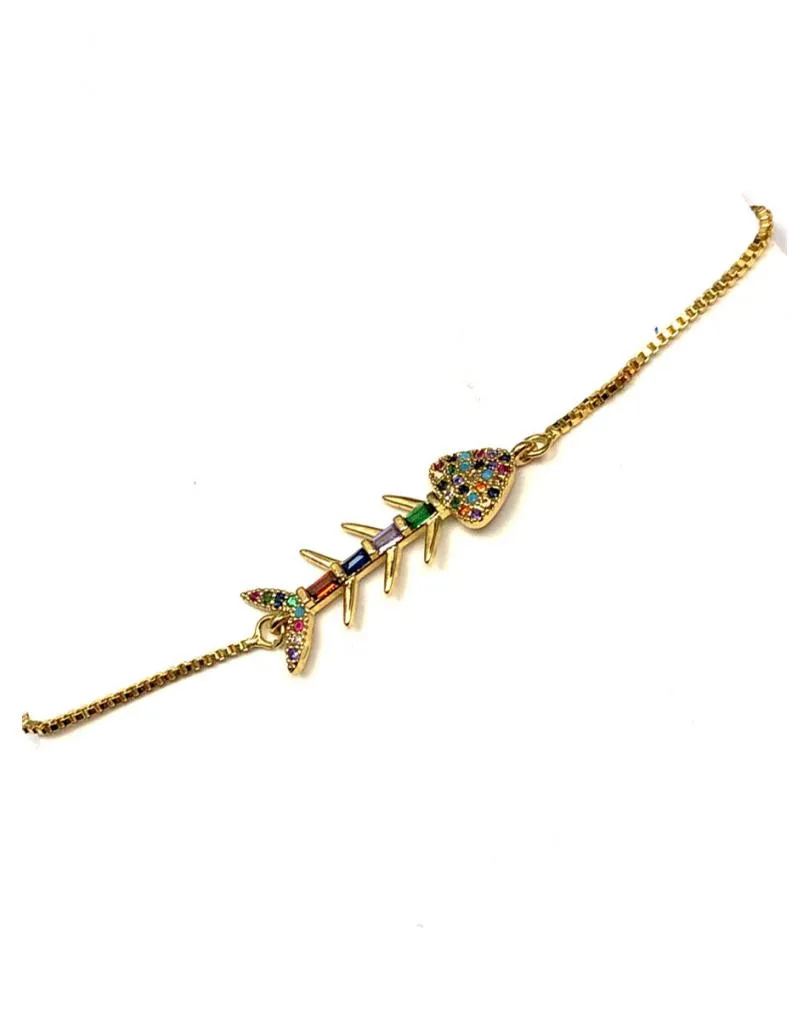 PULSERAS DORADAS CON GRACIOSA RASPA DE PESCADO MULTICOLOR